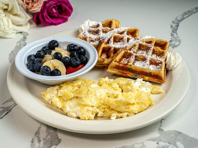 Kid's Breakfast Scrambled Eggs, Fruity Pebbles Waffles, Fresh Fruit.